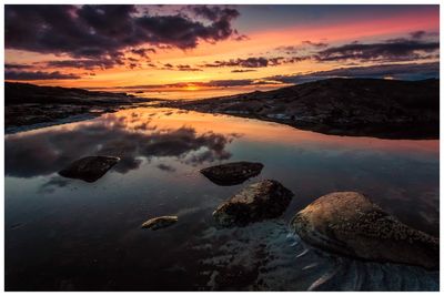 Scenic view of sea against sky at sunset