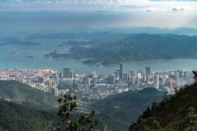 High angle view of buildings and mountains against sky