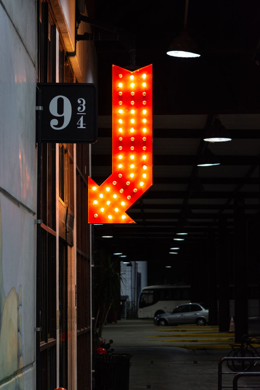 ILLUMINATED ROAD SIGN ON CITY STREET