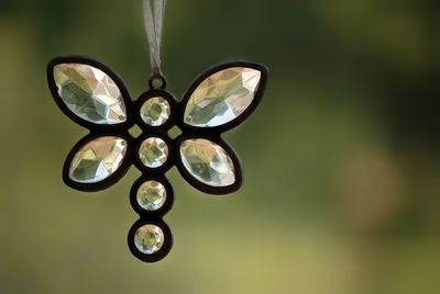 Close-up of diamond pendant outdoors