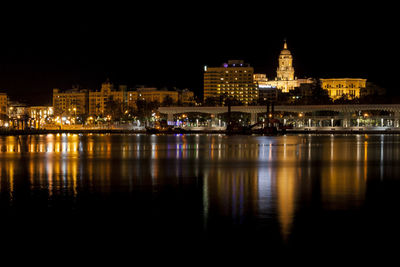 Illuminated buildings in city at night