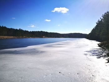 Scenic view of frozen lake against sky