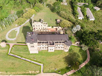 High angle view of trees and houses on field