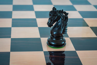 High angle view of chess pieces on floor