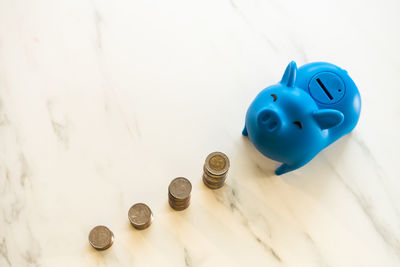 High angle view of coins on table
