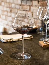 Close-up of wineglass on table