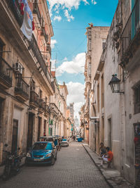 Narrow alley amidst buildings in city