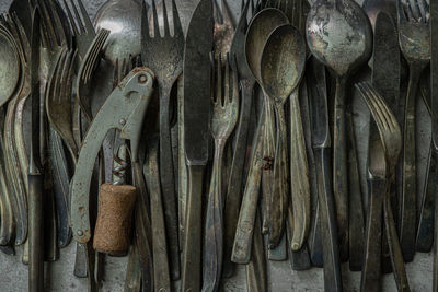 Close-up of old clothes hanging on wood