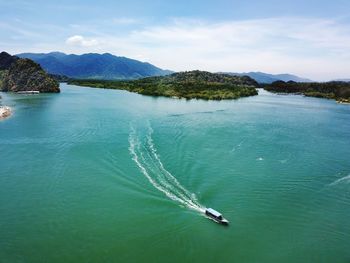 High angle view of boat sailing on sea against sky