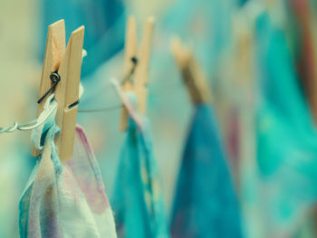 Close-up of clothespins hanging on clothesline