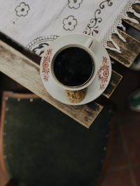 High angle view of coffee cup on table