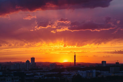 Buildings against sky during sunset