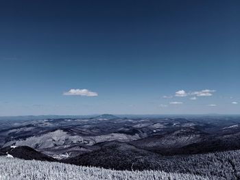 Scenic view of landscape against blue sky