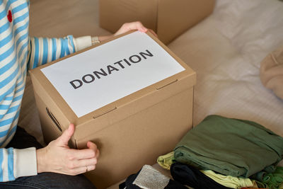 Midsection of woman holding gift