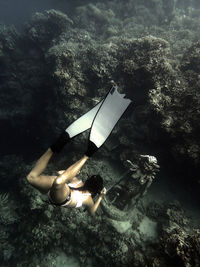 Freediving girl meeting medusa