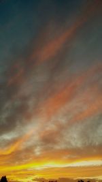 Low angle view of dramatic sky during sunset