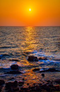 Scenic view of sea against sky during sunset