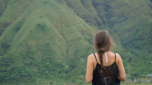 Woman looking at waterfall