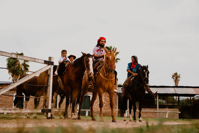 South american family riding horses