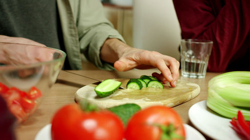 Young couple preparing food in kitchen at home