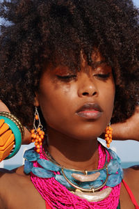 Portrait of a young black woman wearing colorful jewelry