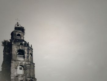 Low angle view of clock tower against sky