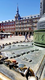 People at town square against clear sky