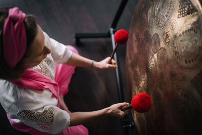 Midsection of woman holding christmas decoration