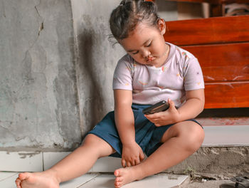 Boy sitting on steps