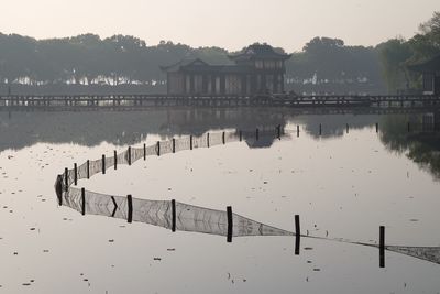 Pier over lake against sky