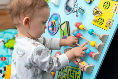 Close-up of boy playing with toy