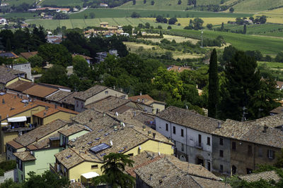 High angle view of houses and trees in town