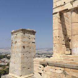 Low angle view of fort against clear blue sky