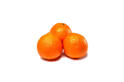 Close-up of oranges against white background