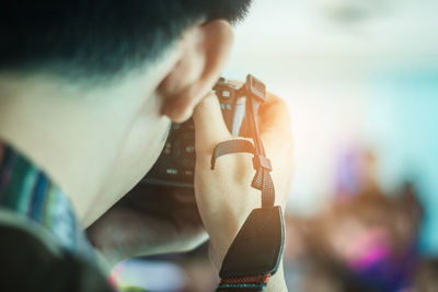 Close-up of man photographing