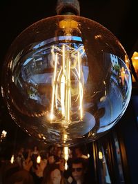 Low angle view of illuminated light bulb