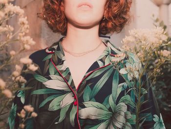 Portrait of young woman standing outdoors