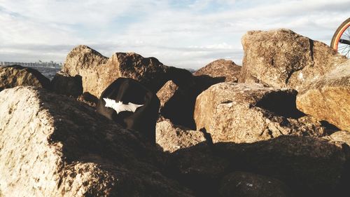 Scenic view of rocks in sea against sky