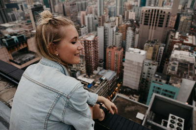 High angle view of man using mobile phone in city