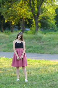 Full length of woman standing on field