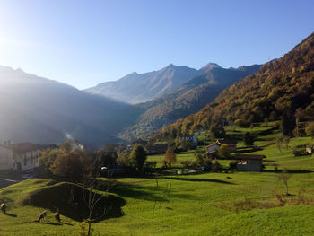 Scenic view of landscape and mountains against sky