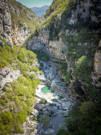 High angle view of water flowing through rocks