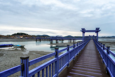 Pier over sea against sky