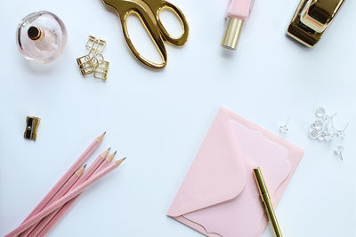 High angle view of personal accessories over white background