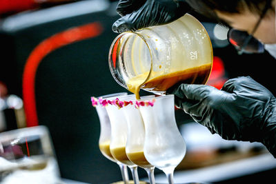 Midsection of woman holding drink