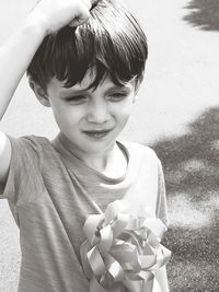Boy holding mannequin