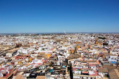 High angle view of townscape against clear blue sky