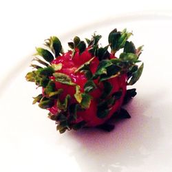 Close-up of strawberry over white background