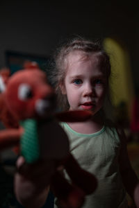 Portrait of cute boy with toy