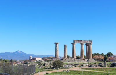 Panoramic view of temple against clear blue sky